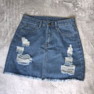 light washed distressed denim mini skirt
